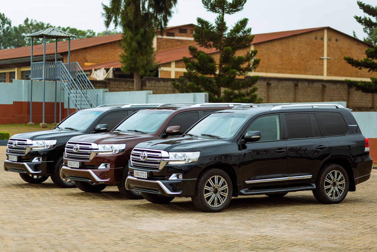 A lineup of black Toyota SUVs displayed at a used dealership in Houston, highlighting premium and reliable pre-owned vehicle options