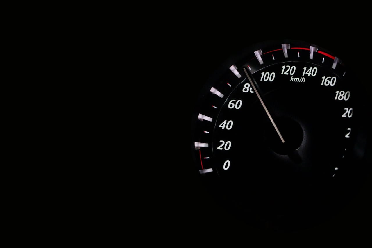 Close-up of a car speedometer showing high speed, symbolizing advanced automotive performance and smart driving technology.